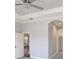 Light and bright bedroom featuring neutral walls, crown molding, and view of the ensuite bathroom at 12822 Del Corso Loop, Bradenton, FL 34211