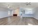 Large bonus room with vaulted ceilings, ceiling fans, built in cabinet and plank flooring at 12822 Del Corso Loop, Bradenton, FL 34211
