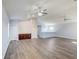 Large bonus room featuring vaulted ceilings, ceiling fans, built in cabinet and plank flooring at 12822 Del Corso Loop, Bradenton, FL 34211