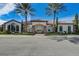 Beautiful clubhouse with red tiled roof, stone columns, and nicely manicured landscaping at 12822 Del Corso Loop, Bradenton, FL 34211