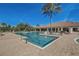 Large community pool with ample lounge seating and a well-maintained deck area at 12822 Del Corso Loop, Bradenton, FL 34211