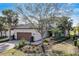 Charming two-story home with a brick driveway, lush landscaping, and a two car garage at 12822 Del Corso Loop, Bradenton, FL 34211