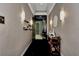 Tastefully decorated hallway with unique lighting fixtures and elegant furnishings at 12822 Del Corso Loop, Bradenton, FL 34211