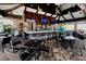 Outdoor bar area with tables, chairs, TVs, and fans at 12822 Del Corso Loop, Bradenton, FL 34211