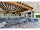 Inviting outdoor patio with comfortable seating, a fireplace, and mounted televisions at 12822 Del Corso Loop, Bradenton, FL 34211