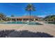 Beautiful community pool with large pool, tables, lounge chairs, and palm trees on a sunny day at 12822 Del Corso Loop, Bradenton, FL 34211