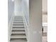 Staircase with white risers and stringers leading to the second floor at 12822 Del Corso Loop, Bradenton, FL 34211