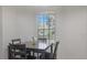 Cozy dining area with a wooden table set near a bright window at 1298 Russellville St, North Port, FL 34288