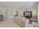 Inviting living room with a modern entertainment center and open archways to other rooms at 1298 Russellville St, North Port, FL 34288