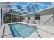 Enclosed pool features a screened-in lanai and ample space for outdoor seating at 1298 Russellville St, North Port, FL 34288
