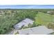 Aerial view of the property showcasing the lush landscaping and golf course proximity at 1432 Colony Pl, Venice, FL 34292