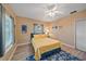 Cozy bedroom with wood floors, ample natural light, and a comfortable bed at 1432 Colony Pl, Venice, FL 34292