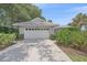 Lovely home featuring a two-car garage and a well maintained landscaped front yard at 1432 Colony Pl, Venice, FL 34292