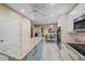 Updated kitchen with an island, granite countertops, and stainless steel appliances at 1432 Colony Pl, Venice, FL 34292
