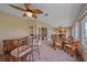 Spacious living room with a wet bar, comfortable seating, and a view to an adjacent room at 1432 Colony Pl, Venice, FL 34292