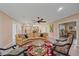 Open concept living area with hardwood floors, comfortable seating, and a dining area at 1432 Colony Pl, Venice, FL 34292