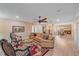 Spacious open concept living area with hardwood floors, a ceiling fan, and dining area at 1432 Colony Pl, Venice, FL 34292
