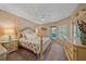 Main bedroom featuring a comfortable bed, soft lighting, and neutral decor at 1432 Colony Pl, Venice, FL 34292