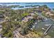 Aerial view of properties with a marina and waterfront views at 1629 Pelican Cove Rd # 138A, Sarasota, FL 34231
