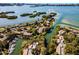 Aerial view of condos with boat docks on the water at 1629 Pelican Cove Rd # 138A, Sarasota, FL 34231