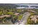 Scenic aerial view of waterfront condos with boat docks and lush landscaping on a sunny day at 1629 Pelican Cove Rd # 138A, Sarasota, FL 34231