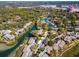 Aerial view of community with a marina, a river, and a swimming pool at 1629 Pelican Cove Rd # 138A, Sarasota, FL 34231