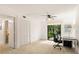 Bright bedroom features a large closet and a view to a lush outdoor space at 1629 Pelican Cove Rd # 138A, Sarasota, FL 34231