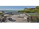 Deck with furniture overlooking the water at 1629 Pelican Cove Rd # 138A, Sarasota, FL 34231