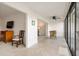 Bright living area with tile flooring that leads to screened in seating area at 1629 Pelican Cove Rd # 138A, Sarasota, FL 34231