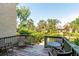 Outdoor patio with seating and lush landscaping, ideal for enjoying the natural surroundings at 1629 Pelican Cove Rd # 138A, Sarasota, FL 34231