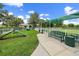 Fenced dog park with green space, bench, and agility equipment at 1739 Lake Verona Cir, Bradenton, FL 34211
