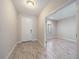 Bright foyer featuring tile floors, white front door, and an adjacent office space at 1739 Lake Verona Cir, Bradenton, FL 34211