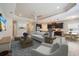 Spacious living room with hardwood floors, a ceiling fan, and an open floor plan with the dining room and kitchen at 1739 Lake Verona Cir, Bradenton, FL 34211
