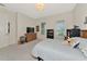 Cozy bedroom with large windows, plush carpet and stylish desk and shelving at 17904 Palmiste Dr, Bradenton, FL 34202