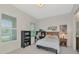 Bright bedroom with ample natural light, desk and book shelving for maximized comfort at 17904 Palmiste Dr, Bradenton, FL 34202