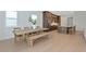 Bright dining area featuring a wooden table and bench seating with lots of natural light at 17904 Palmiste Dr, Bradenton, FL 34202