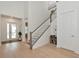 Bright foyer with wood flooring, staircase, and high ceilings at 17904 Palmiste Dr, Bradenton, FL 34202