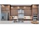 Modern kitchen featuring a large island, stainless steel appliances, and beautiful cabinetry at 17904 Palmiste Dr, Bradenton, FL 34202