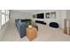 Spacious carpeted living room with a comfortable sectional sofa, and modern entertainment center at 17904 Palmiste Dr, Bradenton, FL 34202