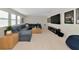 Inviting living room featuring a large sectional sofa, entertainment center, and lots of natural light at 17904 Palmiste Dr, Bradenton, FL 34202