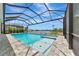 Stunning screened-in pool area with a beautiful lake view, perfect for outdoor relaxation and entertainment at 17904 Palmiste Dr, Bradenton, FL 34202