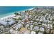 Real estate aerial view of neighborhood near white sand beach with luxury homes and blue water at 205 71St St # B, Holmes Beach, FL 34217