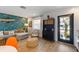 Cozy living room features stylish decor, a comfortable sectional, and a door leading to outdoor at 205 71St St # B, Holmes Beach, FL 34217