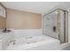 A luxurious bathtub and a separate glass-enclosed shower in a relaxing, spa-like bathroom at 2120 Harbourside Dr # 617, Longboat Key, FL 34228