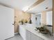 Bright bathroom with a white countertop, a large mirror, and a neutral color scheme at 2120 Harbourside Dr # 617, Longboat Key, FL 34228
