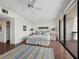 Bright bedroom with a ceiling fan, tile flooring, and a large sliding door leading to a balcony at 2120 Harbourside Dr # 617, Longboat Key, FL 34228