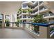 Condominium courtyard with tropical landscaping, blue railings, and tiled floors at 2120 Harbourside Dr # 617, Longboat Key, FL 34228