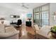 Comfortable living room with a ceiling fan, tile flooring, a TV, and a seating area at 2120 Harbourside Dr # 617, Longboat Key, FL 34228