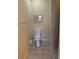 Bright bathroom featuring a standard toilet and tile flooring at 24028 Park Place S Dr # 32, Punta Gorda, FL 33980