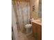 Cozy bathroom showcasing a single vanity and shower with a beach-themed curtain at 24028 Park Place S Dr # 32, Punta Gorda, FL 33980